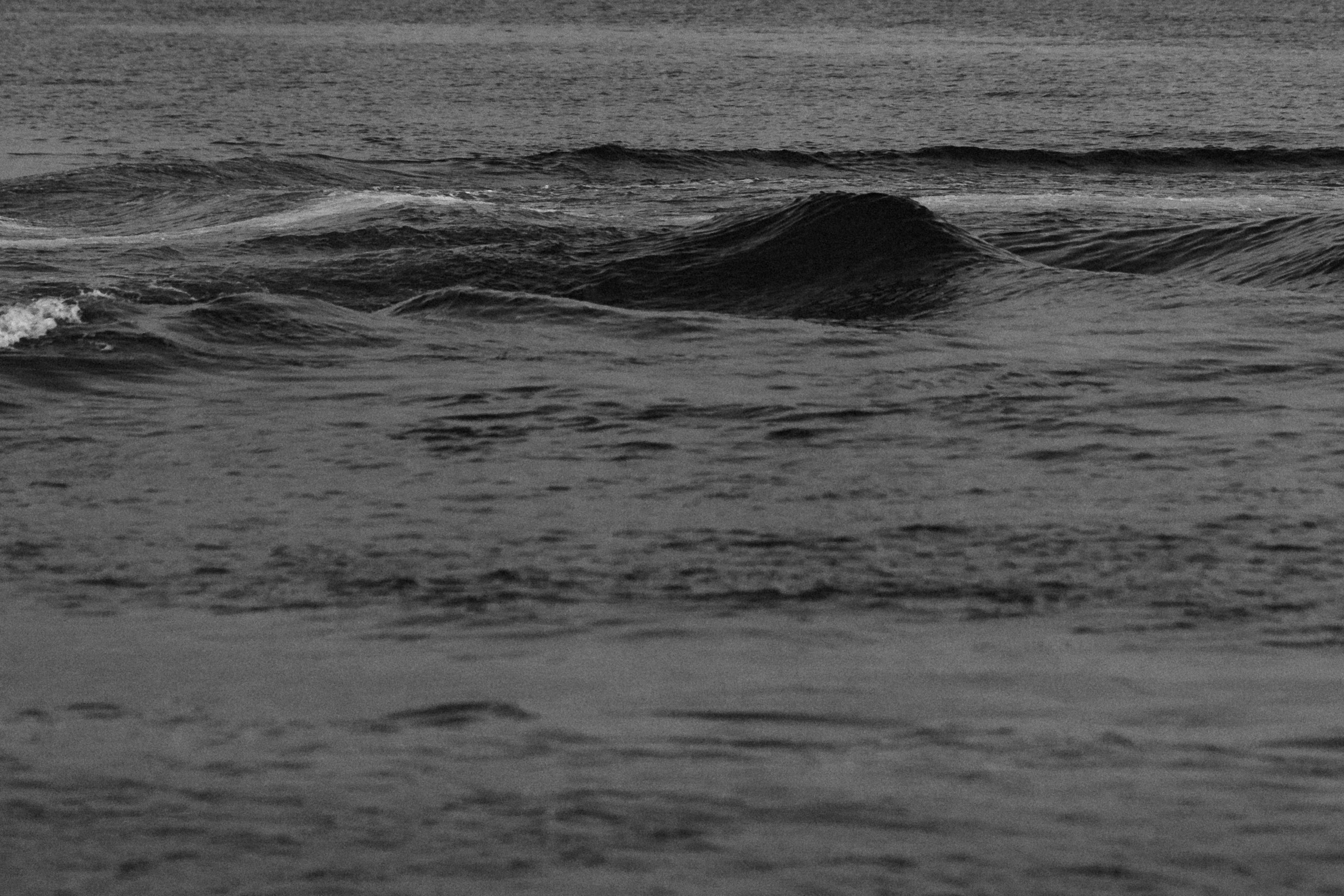 grayscale photo of sea waves